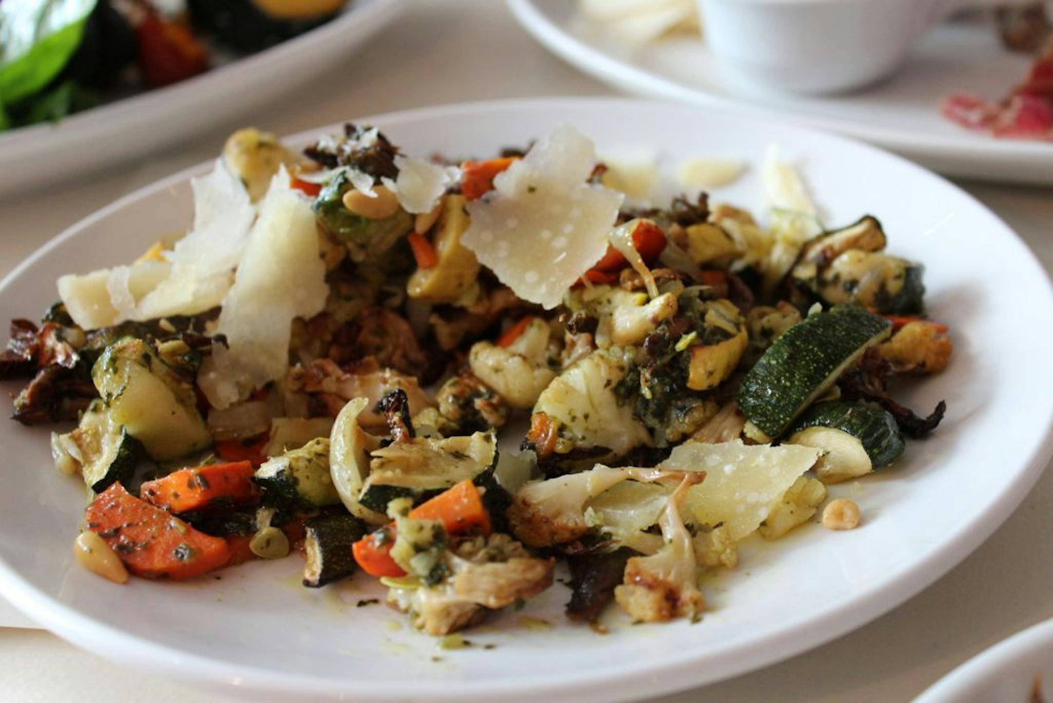 Meat-and-potatoes Omaha turns out a rich stew of culinary invention like roasted veggies with pine nuts and cheese that are served up at the French Bulldog restaurant in Omaha, Nebraska.