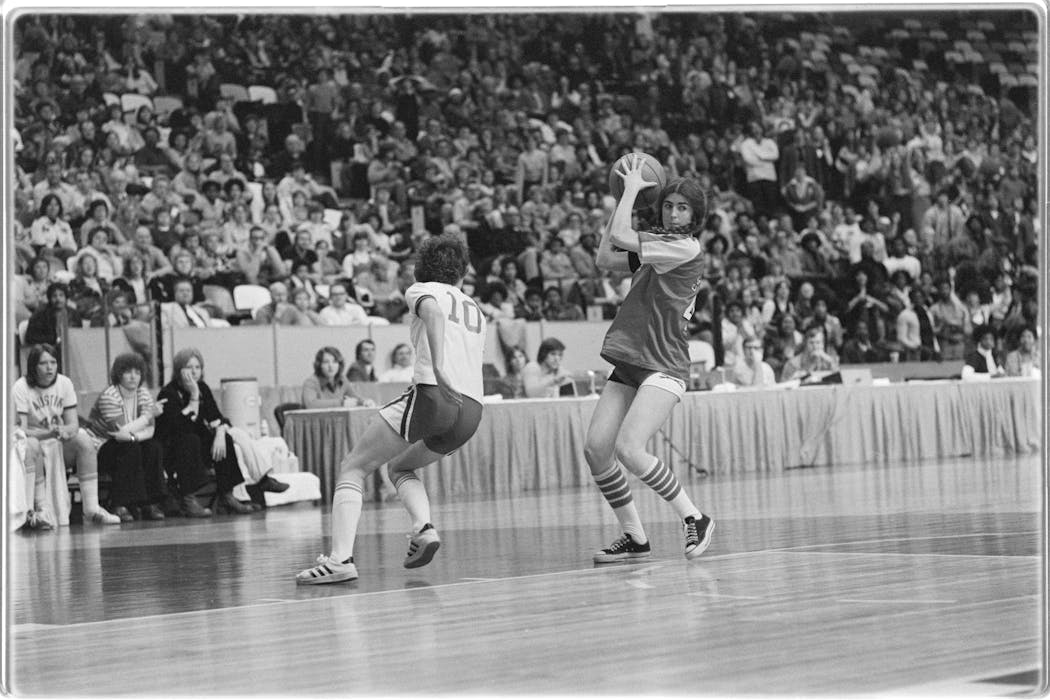 St. Paul Central's Teresa Tierney, now known as Teresa Mauer, holds the ball during Minnesota's first official girls state basketball tournament in February 1976 at Met Center. As a 5-foot-8 guard, Mauer says her role on the team was simply to 