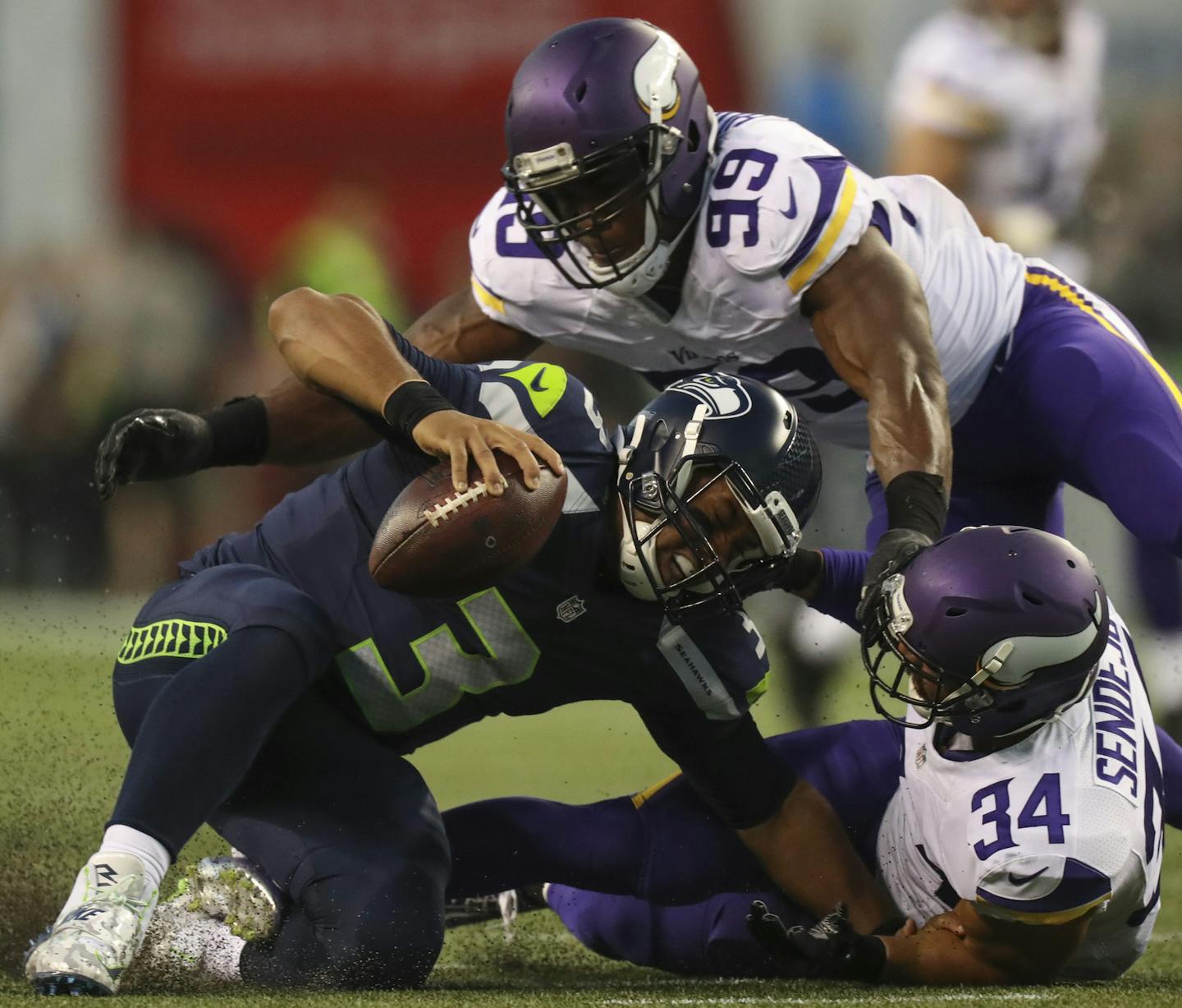 Vikings strong safety Andrew Sendejo (34) sacked Seattle Seahawks quarterback Russell Wilson for an 18 yard loss as teammate Danielle Hunter (99) backed him up in the second quarter Thursday night. ] JEFF WHEELER &#xef; jeff.wheeler@startribune.com The Minnesota Vikings faced the Seattle Seahawks in their second NFL preseason game of the year Thursday night, August 18, 2016 at CenturyLink Field in Seattle.