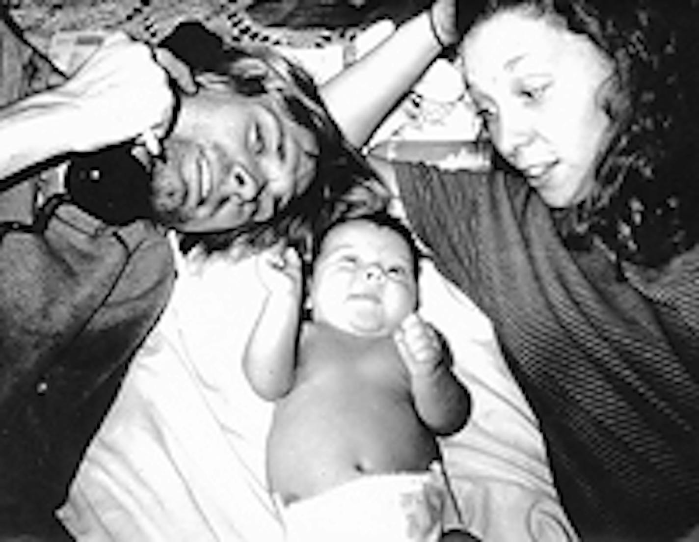 Cobain and Schemel with baby Frances Bean