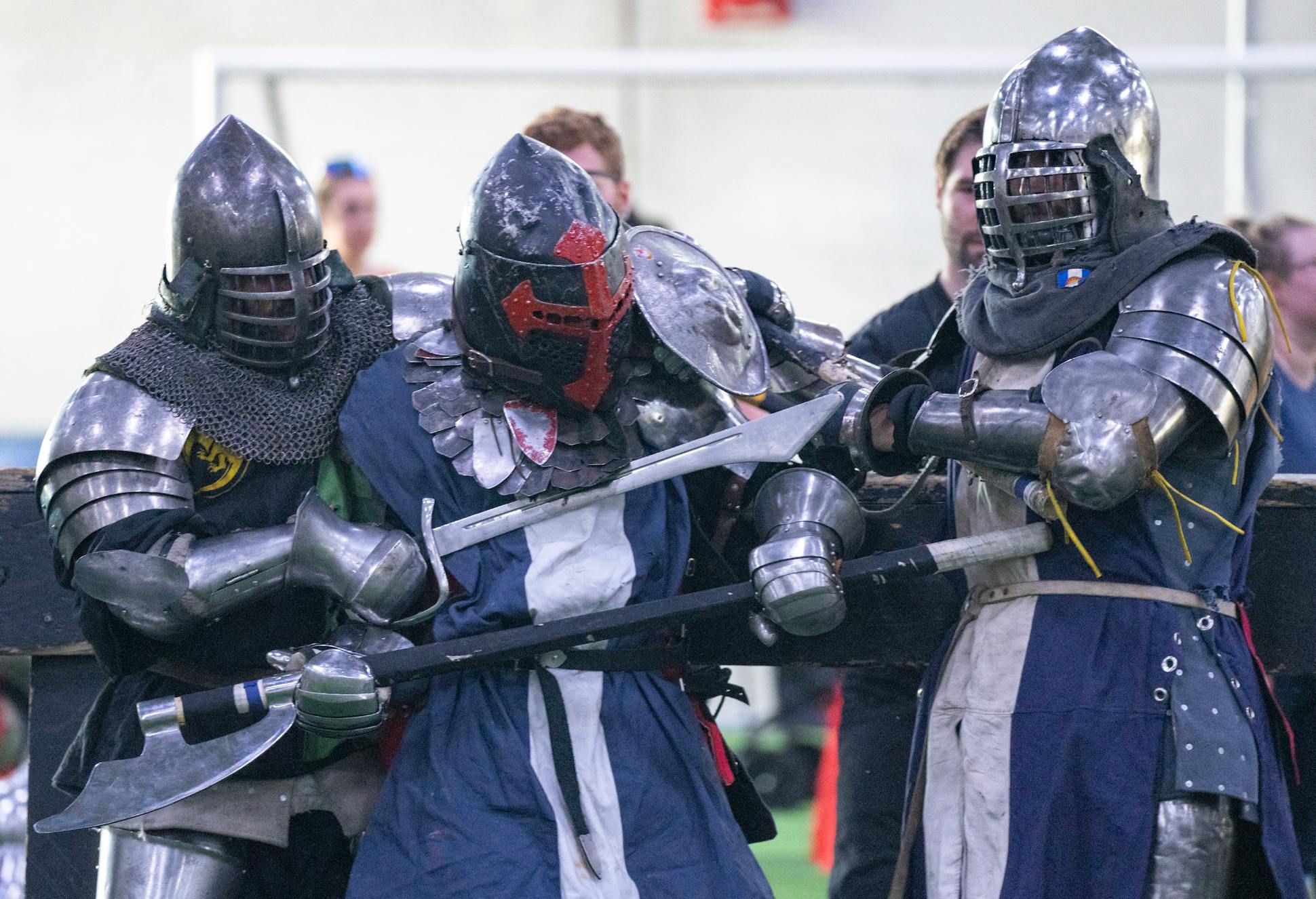 The suits of armor, which combatants must wear, can weigh 100 pounds or more.