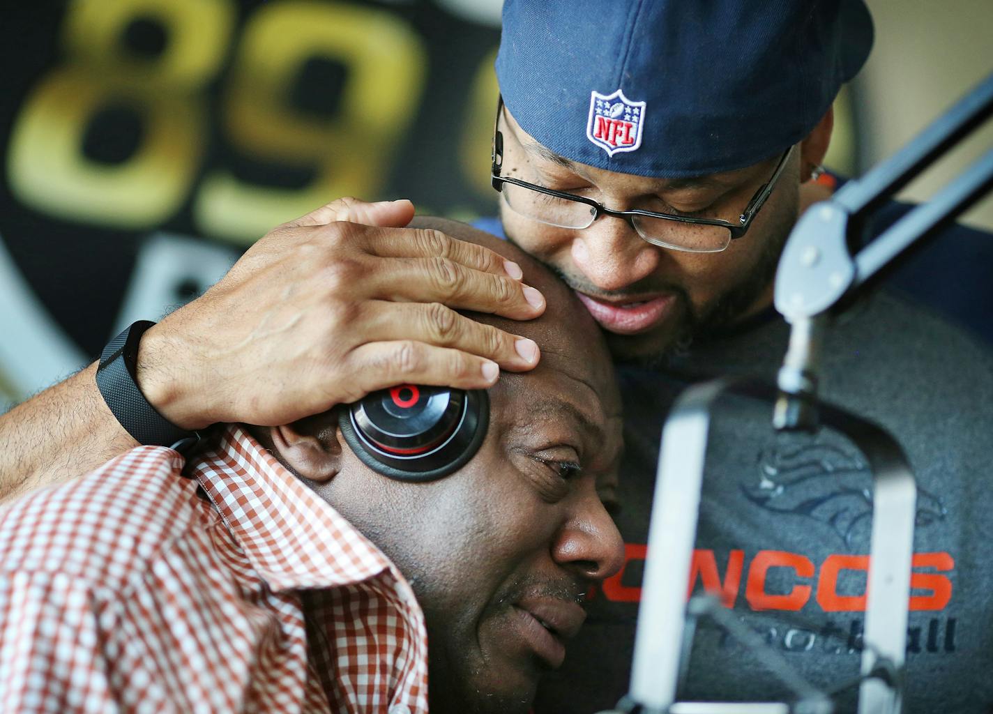 KMOJ host of afternoon drive time show Walter Q Bear Banks left and Shed G embraced each other as they talked about the death of Prince Thursday April 21, 2016 Minneapolis, MN.] Banks a long time resident of Minneapolis grew up with Prince . Jerry Holt /Jerry.Holt@Startribune.com