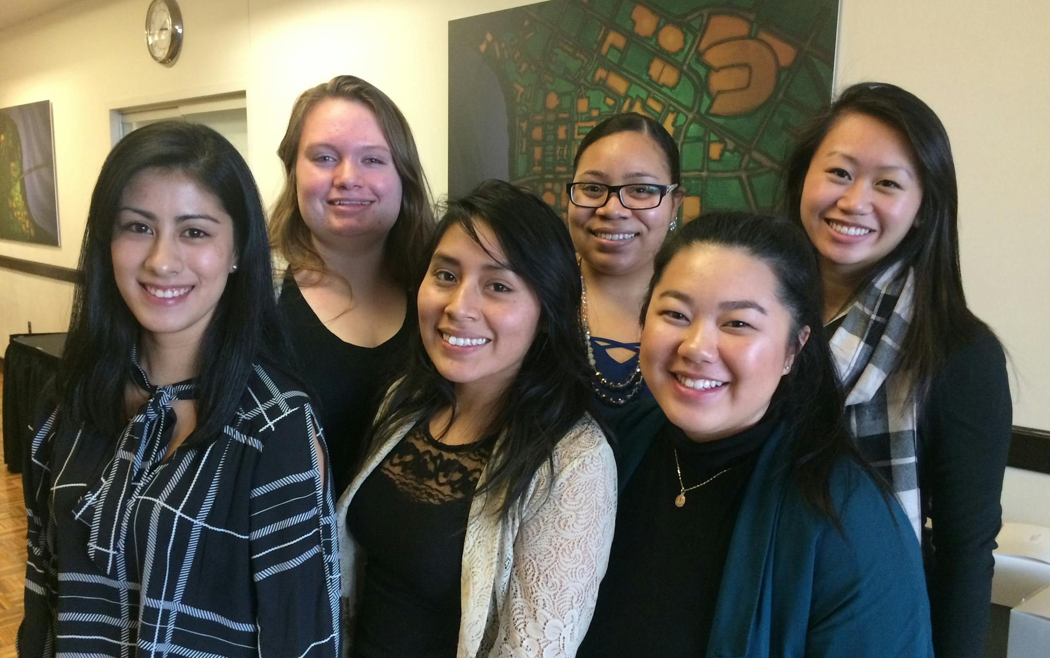 Cecelia Fung (far right), a Vietnamese immigrant and first-generation business school graduate of the University of Minnesota in 2014, benefited from a University YMCA mentoring program that's more than a century old. Fung, who also mentored grade school kids through a work-study job through the U YMCA, is pictured with other university students who have mentors. They are, from left, Brenda Hernandez, Ana Loken, Ana Lozano, Jasmine Lane and Lia Yang. Photo by Neal.St.Anthony@startribune.com
