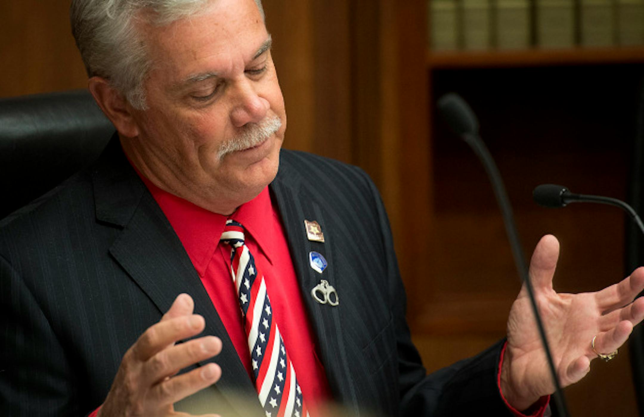 GOP Rep. Tony Cornish sparred with DFL Rep. Michael Paymar over the background check provision in Paymar's bill.  Cornish supports the compromise bill without the background checks.  Supporters of universal background checks for guns faced a stiff test in House public safety committee Tuesday, March 19, 2013.  The bill containing background checks may not have the votes, and the sponsor is seeking a last-minute compromise to keep the concept alive.    ]   GLEN STUBBE * gstubbe@startribune.com