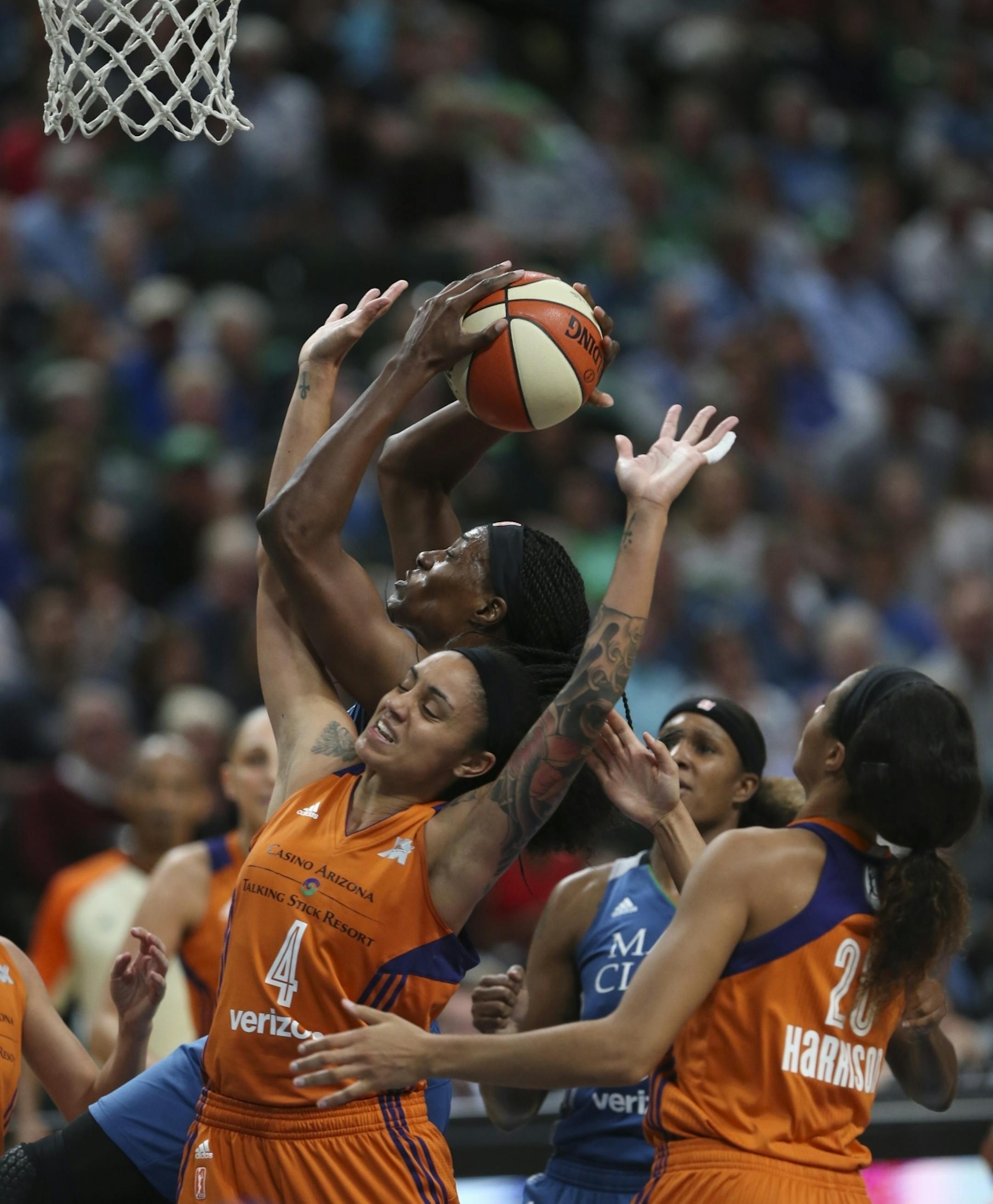 Minnesota Lynx center Sylvia Fowles (34) tangled with Phoenix Mercury forward Candice Dupree (4) while nabbing an offensive rebound in the second half.