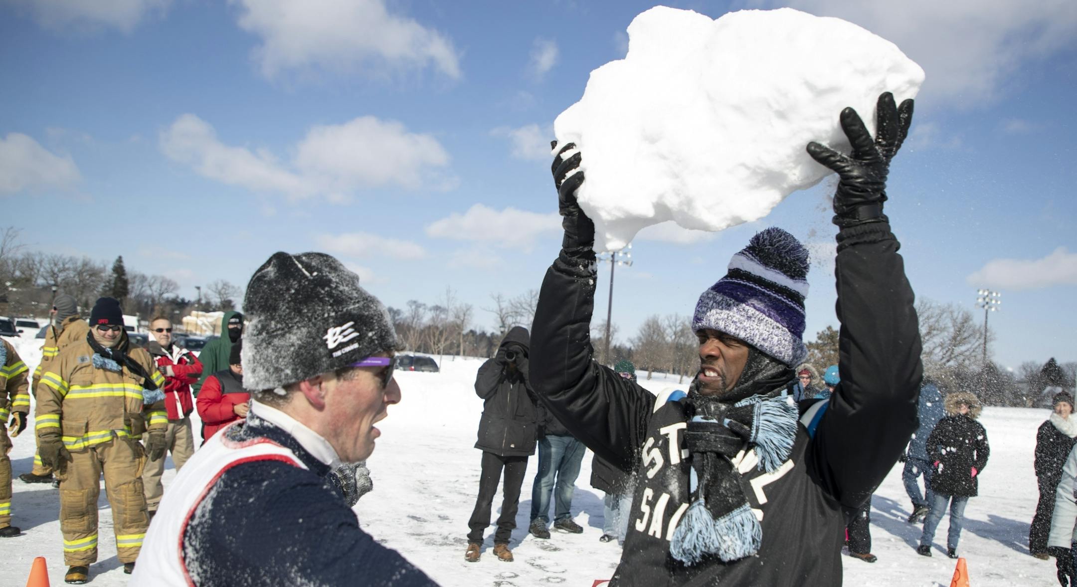 A snowball fight was held at McMurray Fields between the cities of St. Paul and Minneapolis. St. Paul mayor Melvin Carter right prepared to drop a giant snowball on the head of Minneapolis mayor Jacob Frey Sunday February 24, 2019 in St. Paul, MN.
