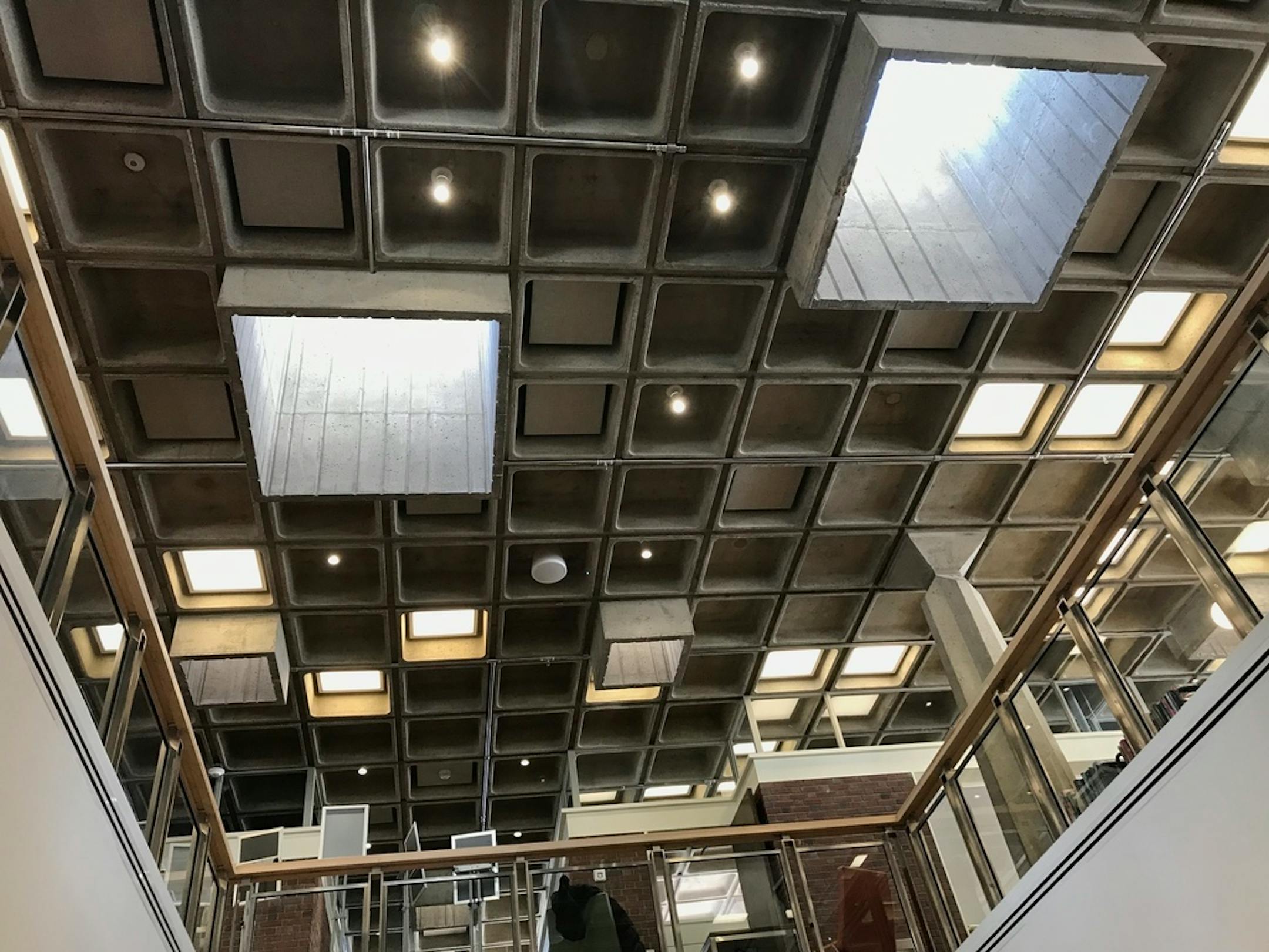 Arvonne Fraser Library, looking up from the lower level. Persistent water leaks had left the basement uninhabitable for the past decade. The solution? Connect the two levels.