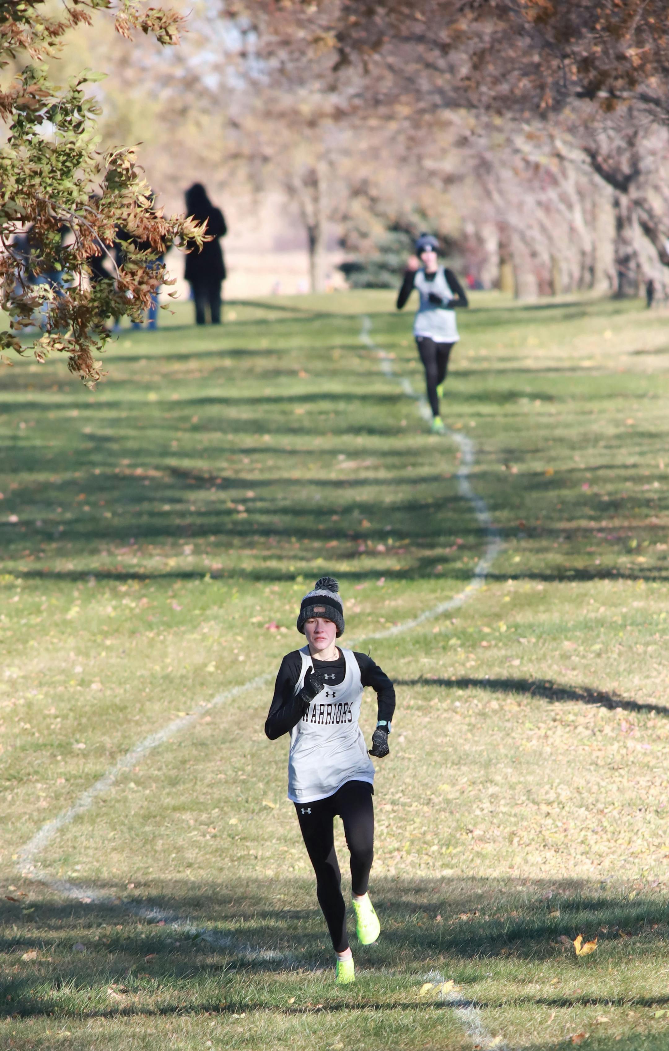 Amanda (front) led twin sister Ashley as the Overgaauw girls led the way in a cross country meet on Monday, Oct. 17, 2022. Photo by Sheila Crowley, Special to the Star Tribune