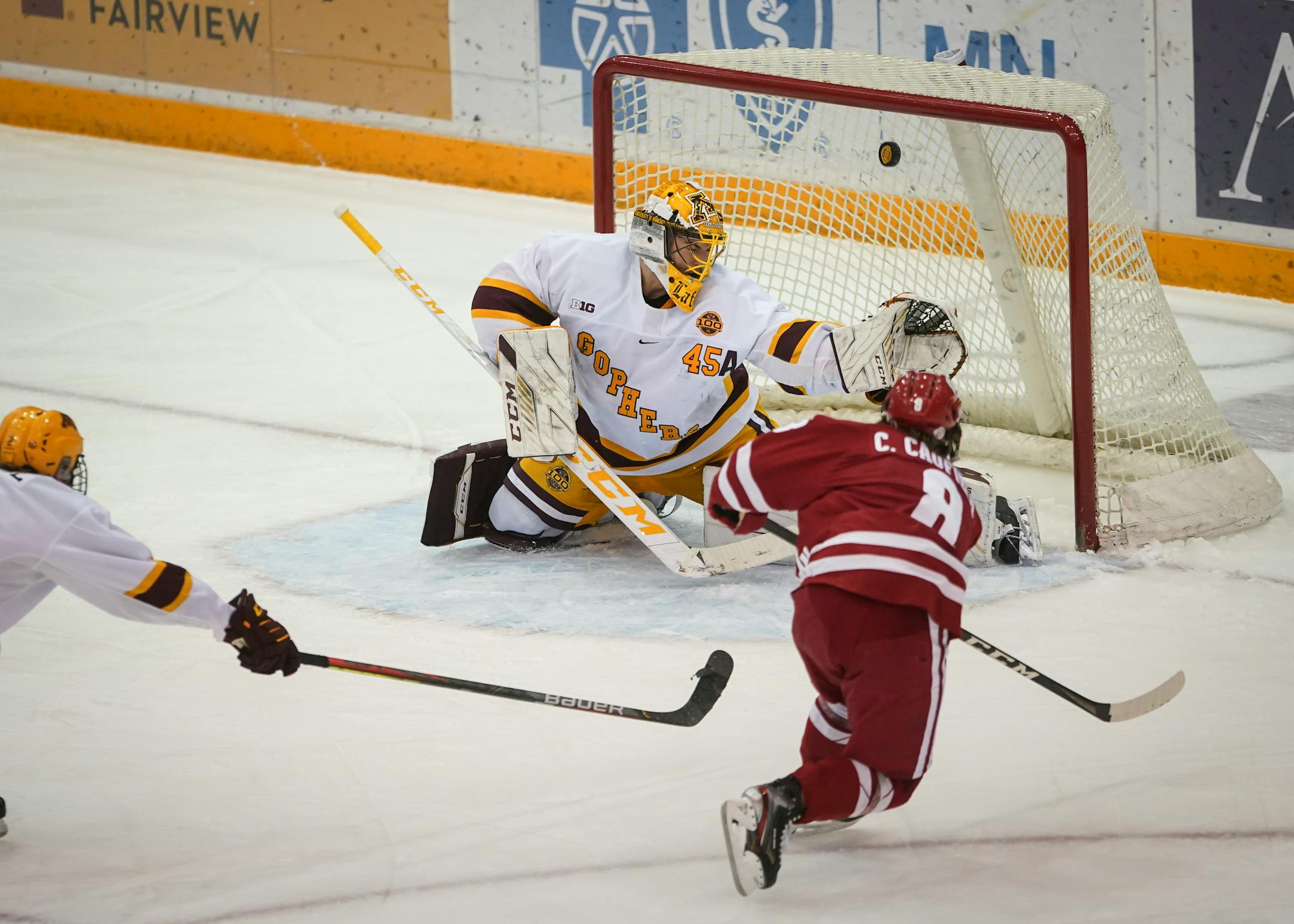 Wisconsin standout forward Cole Caufield sniped the game-winning goal past Gophers goalie Jack LaFontaine, the first of three third-period goals for the Badgers.