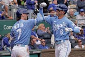Drew Waters (6) celebrates with Bobby Witt Jr. after hitting a solo home run during the fifth inning against the Twins Thursday as part of a three-gam
