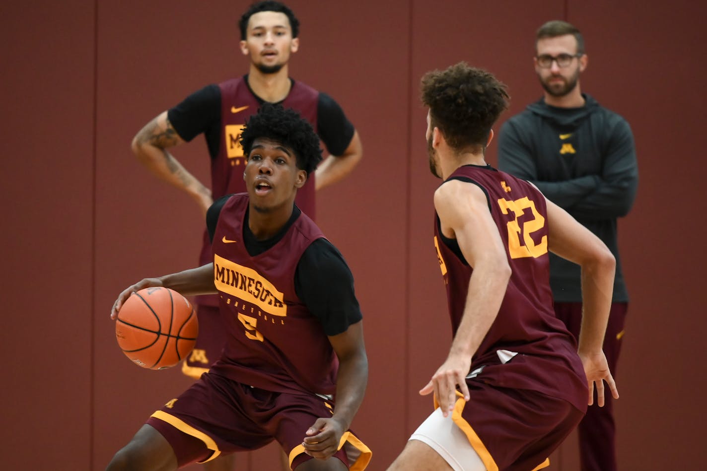 The Gophers' backcourt is again in good shape, with Marcus Carr (dribbling) and Gabe Kalscheur (defending) being rejoined by Payton Willis (back left), coming back from an ankle injury. Freshman Tre' Williams also has supplied quality minutes in Willis' absence.