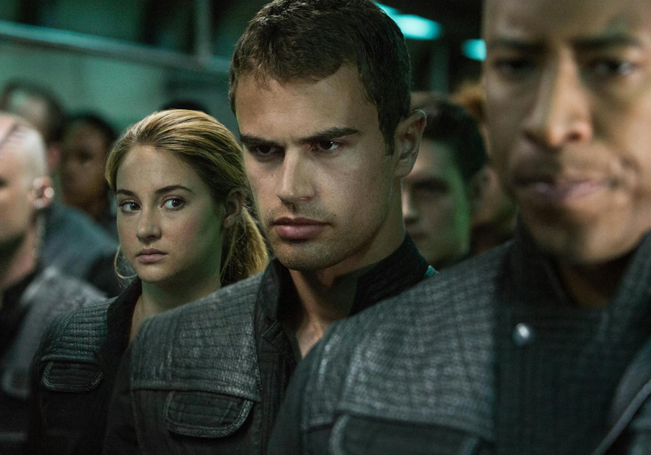 This image released by Summit Entertainment shows Shailene Woodley, left, and Theo James in a scene from "Divergent." (AP Photo/Summit Entertainment, Jaap Buitendijk) ORG XMIT: NYET541