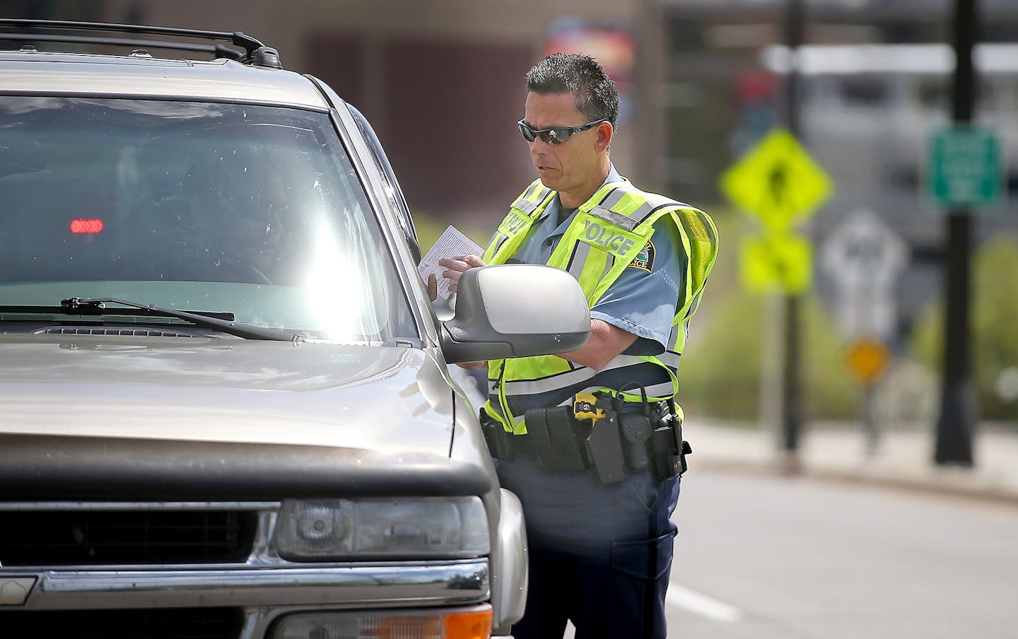 A St. Paul police officer issued a traffic citation after a driver did not stop for a pedestrian at the corner of Kellogg and Mulberry Street, just shortly before a press conference was held to call for end to pedestrian fatalities, Tuesday, May 3, 2016 in St. Paul, MN. The intersection is where pedestrian Shelby Kokesch was killed earlier this year. ] (ELIZABETH FLORES/STAR TRIBUNE) ELIZABETH FLORES &#x2022; eflores@startribune.com