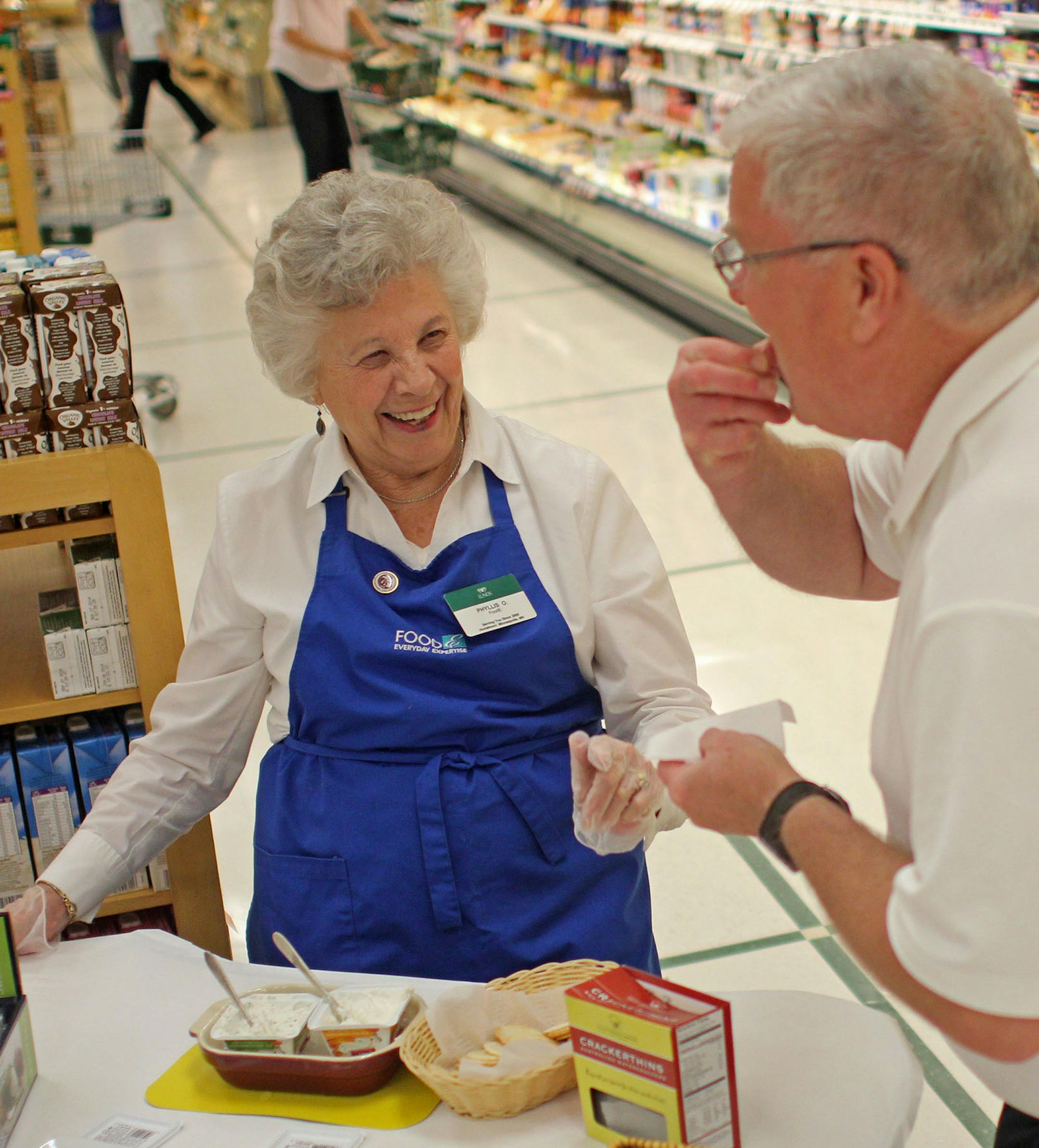 Phyllis Olson passes out samples on one of her last days at Lunds in Richfield. ] Frequent Lunds customer John Haugen described her as the "best salesperson" he knows. MONICA HERNDON monica.herndon@startribune.com Richfield, MN 07/18/14