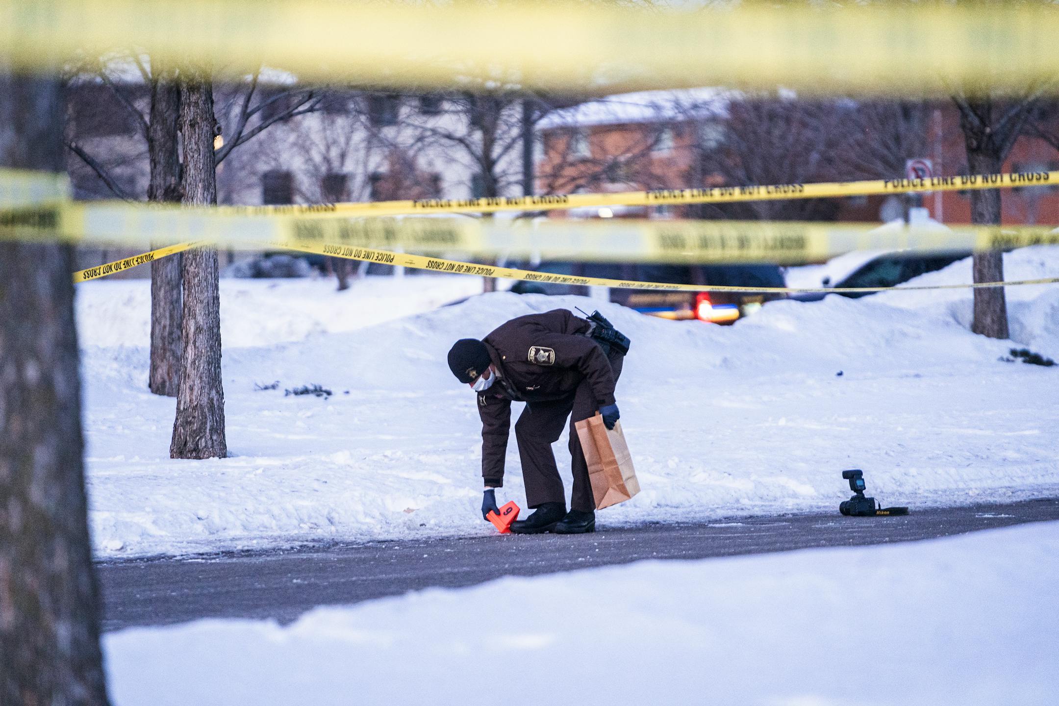 Police collect evidence from the shooting death of Jahmari Rice who was killed in a shooting outside South Education Center , in Richfield, Minn., on Tuesday, Feb. 1, 2022. A vigil followed. ] RICHARD TSONG-TAATARII • richard.tsong-taatarii@startribune.com