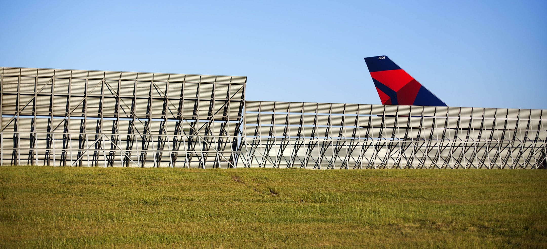 FILE -In this Aug. 27, 2014 file photo, the tail of an airplane is seen as it taxis on the tarmac at Hartsfield-Jackson International Airport in Atlanta. Officials in Atlanta are laying the groundwork for an expansion of the world's busiest airport. According to a news release from the Metro Atlanta Chamber, work will begin soon on a $6 billion expansion and renovation project at the airport. (AP Photo/David Goldman, File) ORG XMIT: AX102