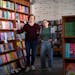 Lauren Richards, left, and Caitlin O'Neil, co-owners of romance bookstore Tropes & Trifles, pose for portrait inside their bookstore in Minneapolis, M