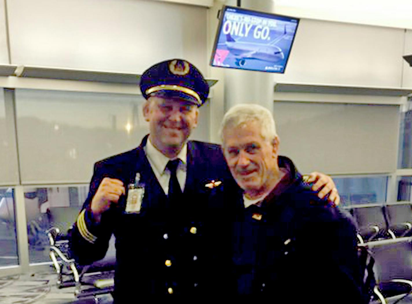 Minnesota wrestling coach J Robinson and former Gophers wrestler Chad Kraft, after a flight from Minneapolis to Las Vegas.