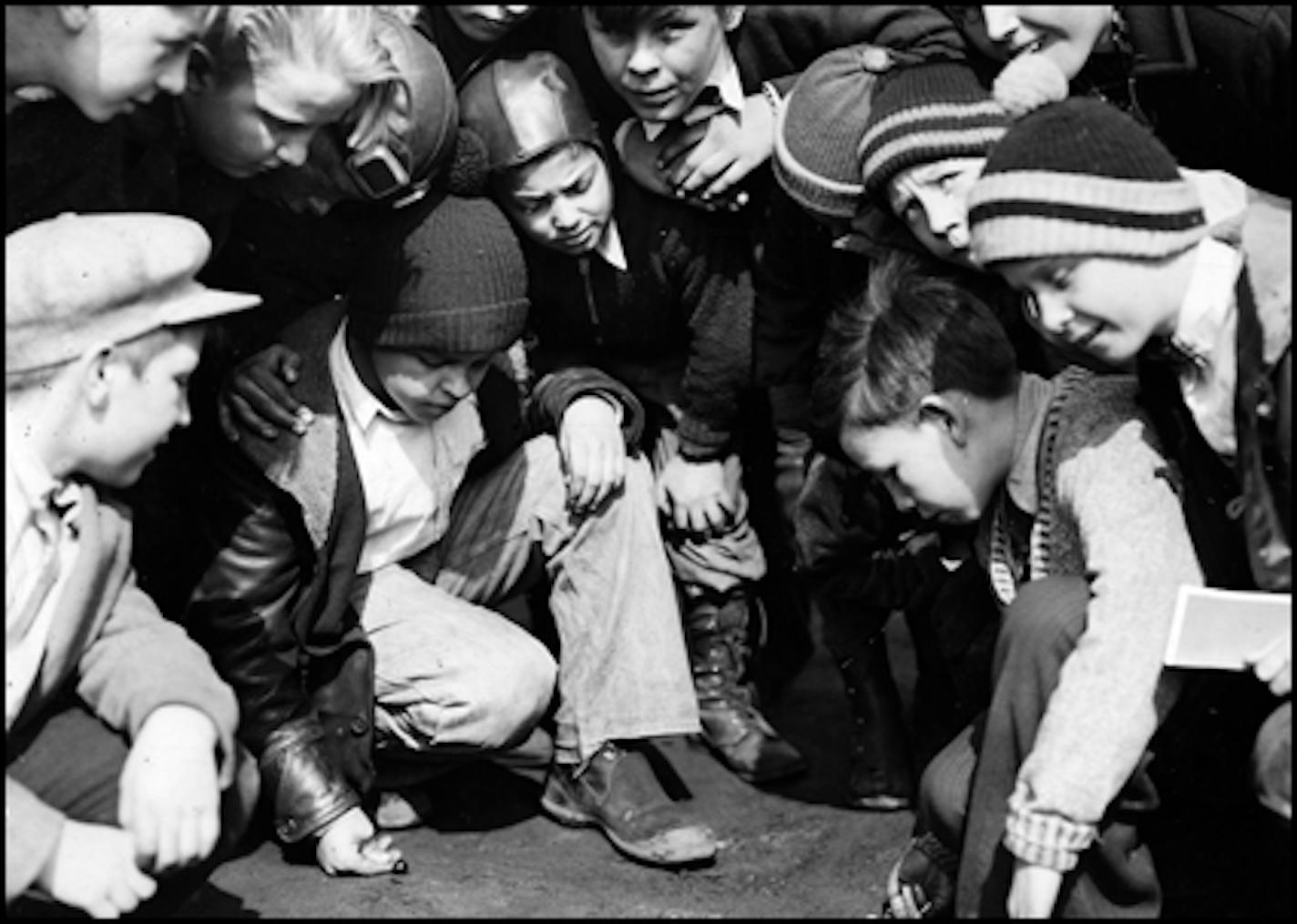 March 1936: Playing marbles at Washington School