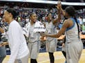 Minnesota Lynx players, from left to right, Plenette Pierson (22), Rebekkah Brunson (32), Sylvia Fowles (34) and Temi Fagbenle (14) celebrate after wi