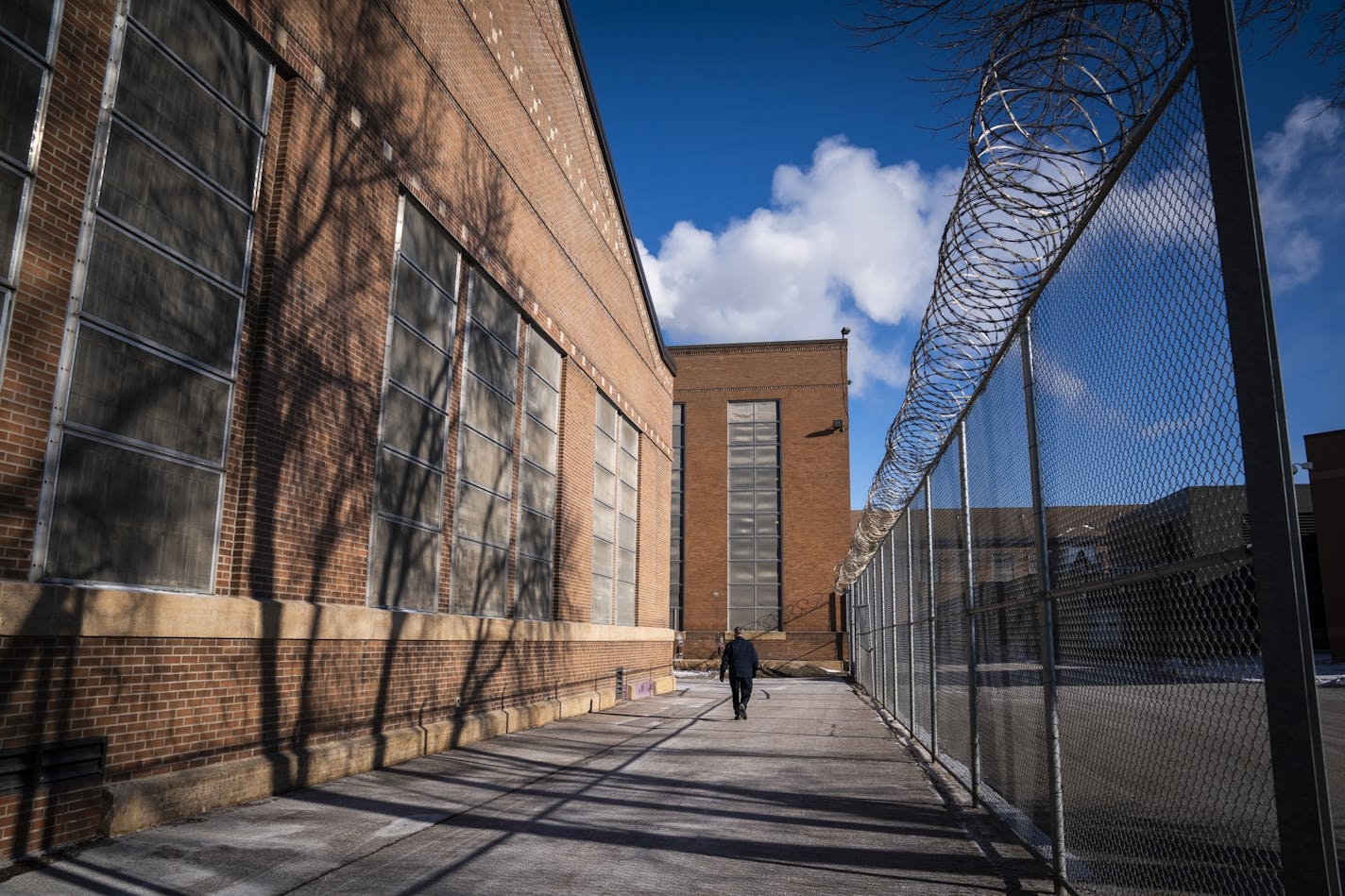 A guard walked outside Stillwater prison on Jan. 25, when Minnesota House lawmakers took a tour.