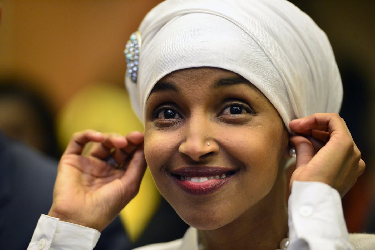 Ilhan Omar adjusted her head scarf while being introduced before speaking at her election watch party Tuesday night. Omar, who proudly wears the hijab, is suddenly thrust into leadership of a rapidly emerging DFL coalition that is younger, more urban and more racially and ethnically diverse than at any time in its history.