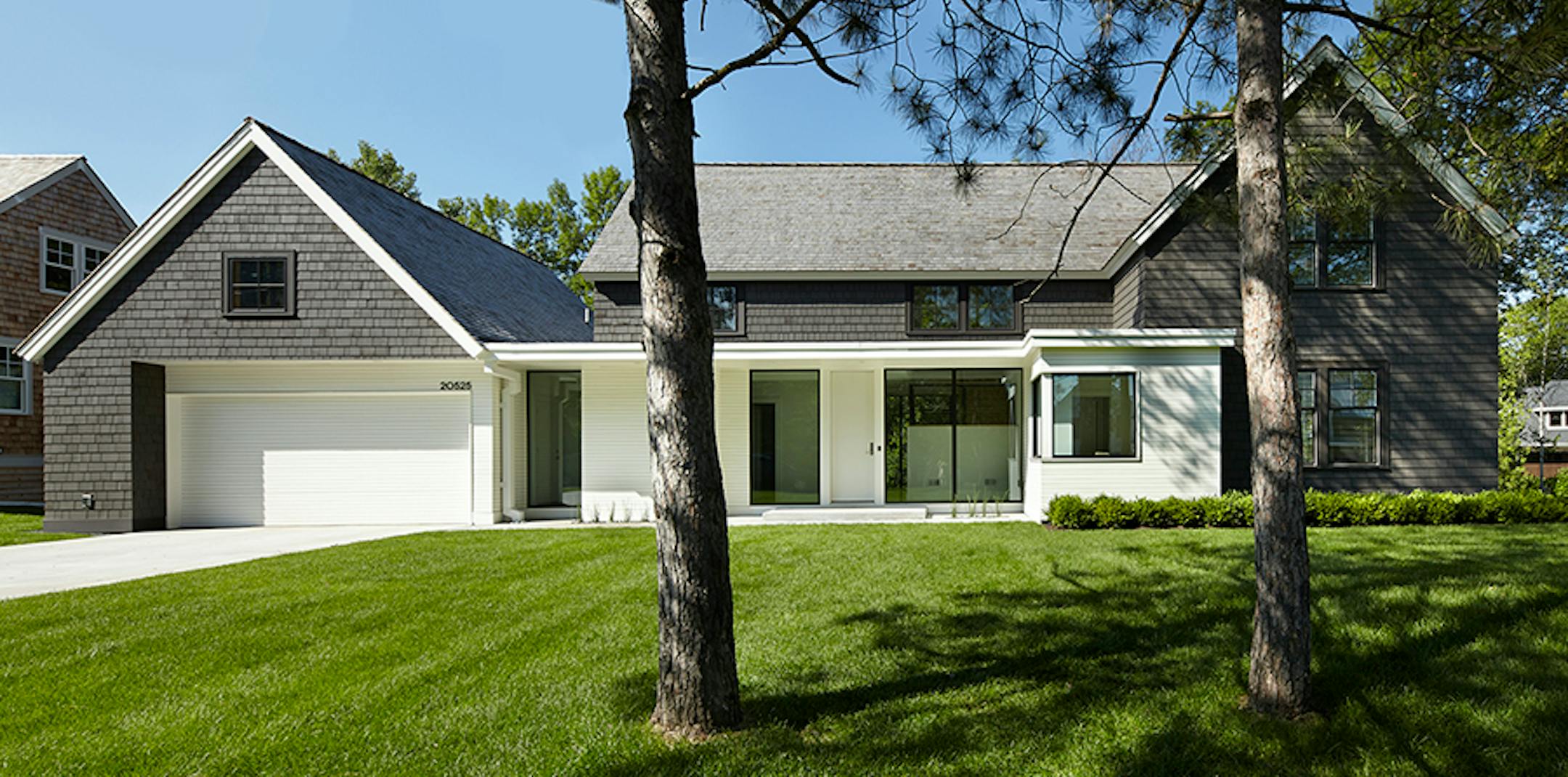 Cottagewood Residence. Lake home has shingle-style elements combined with a modern floor plan, by Peterssen/KellerArchitecture.