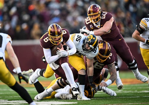 Minnesota Gophers quarterback Athan Kaliakmanis (8) rushes the ball for a gain of six yards during the first half of an NCAA football game Saturday, Nov. 19, 2022 at Huntington Bank Stadium in Minneapolis, Minn.