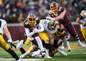 Minnesota Gophers quarterback Athan Kaliakmanis (8) rushes the ball for a gain of six yards during the first half of an NCAA football game Saturday, N
