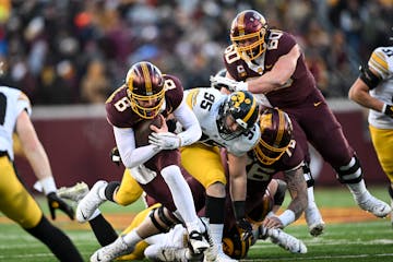 Minnesota Gophers quarterback Athan Kaliakmanis (8) rushes the ball for a gain of six yards during the first half of an NCAA football game Saturday, N