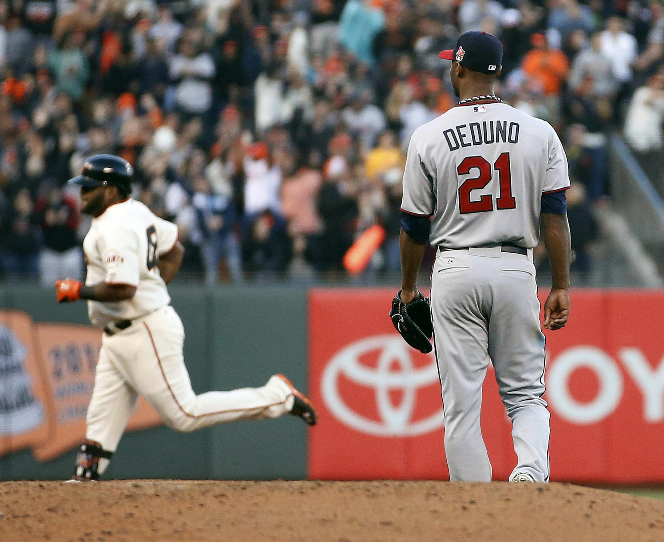 San Francisco Giants' Pablo Sandoval rounds the bases after his solo home run off Minnesota Twins starting pitcher Samuel Deduno (21) during the second inning in the second inning of a baseball game Saturday, May 24, 2014, in San Francisco. (AP Photo/Tony Avelar)