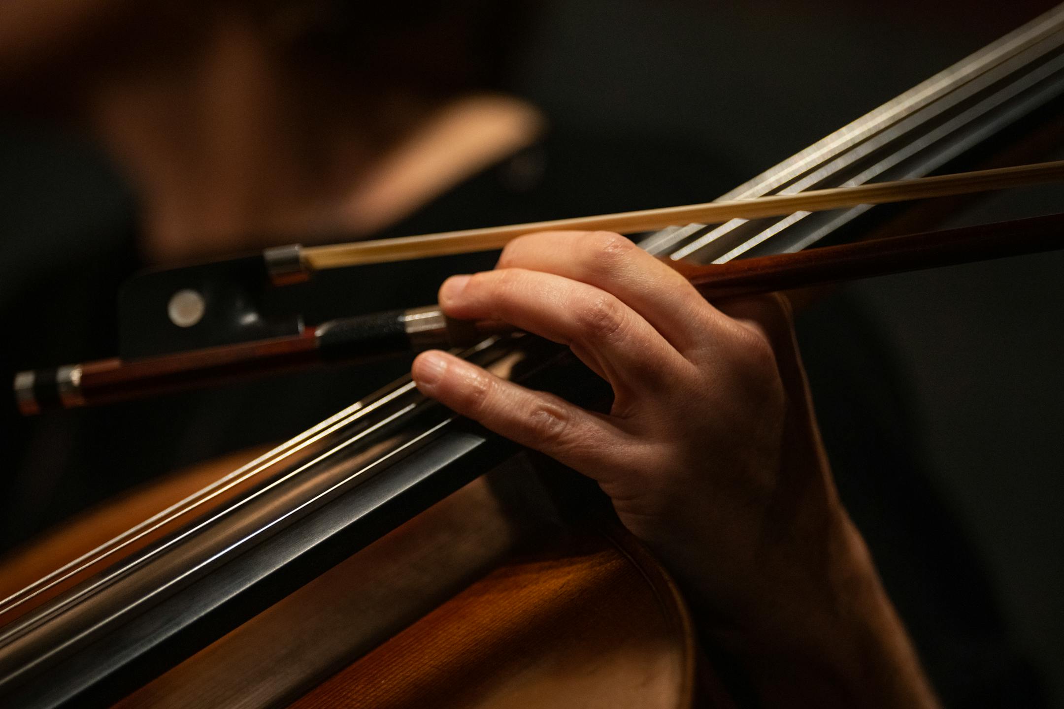 Rebecca Arons plays cello during rehearsal with local band members at the Orpheum Theatre on Nov. 14. 2023.