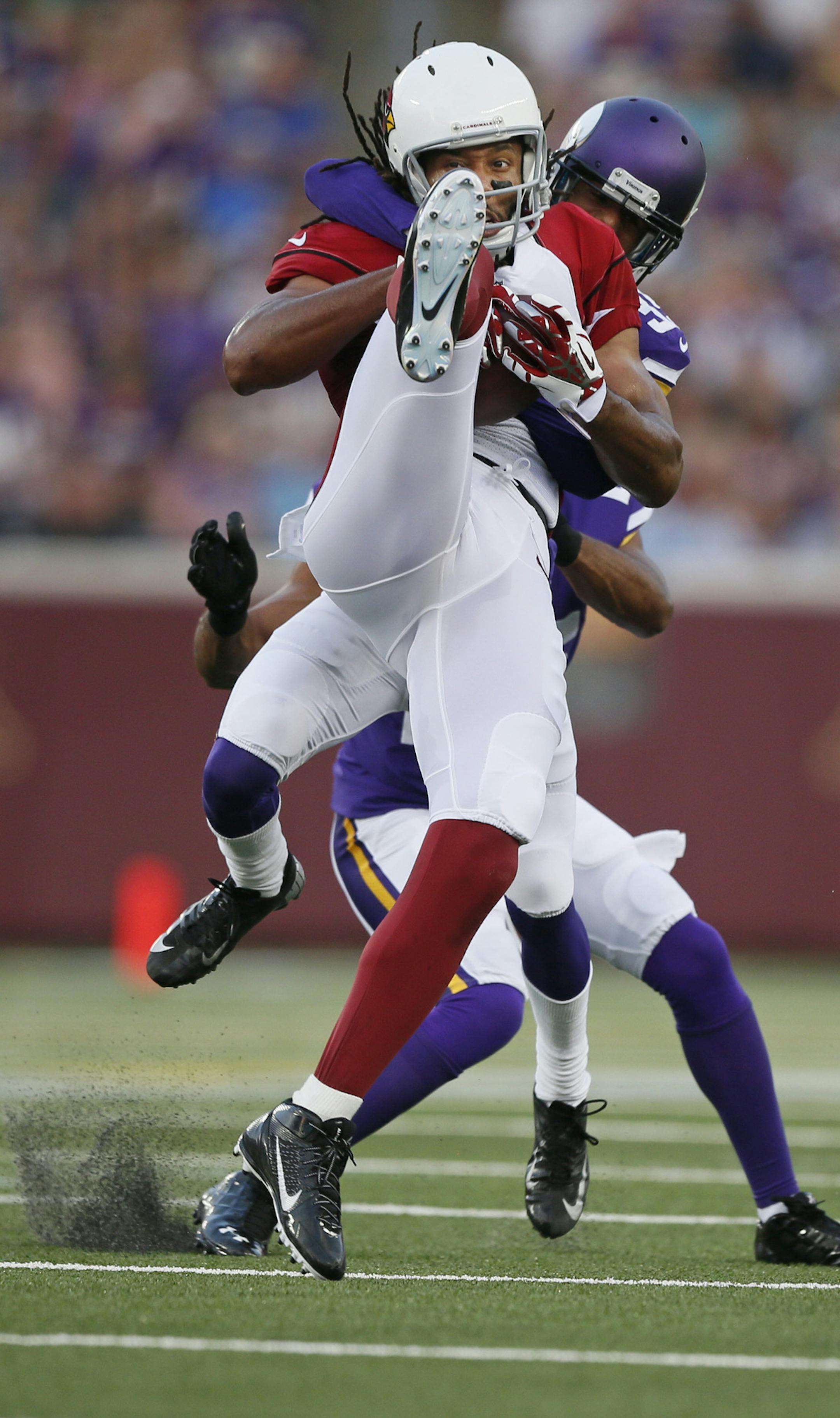 Arizona Cardinals wide receiver Larry Fitzgerald (11) pulled down a catch over Minnesota Vikings cornerback Marcus Sherels (35) during NFL pre-season action between the Minnesota Vikings and the Arizona Cardinals at TCF Bank Stadium Saturday August 16 , 2014 in Minneapolis MN . ] Jerry Holt Jerry.holt@startribune.com
