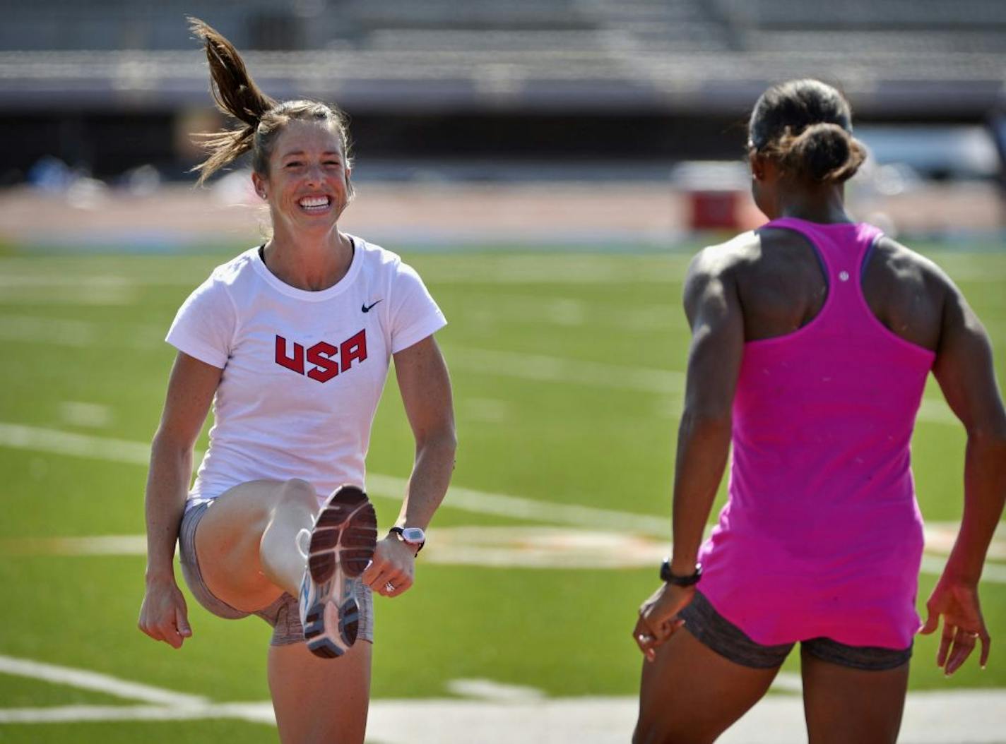 Amanda Smock, left, and Shani Marks worked out at the Macalester College track in St. Paul. Smock, of Melrose, Minn., will represent the United States in the triple jump in the London Olympics.