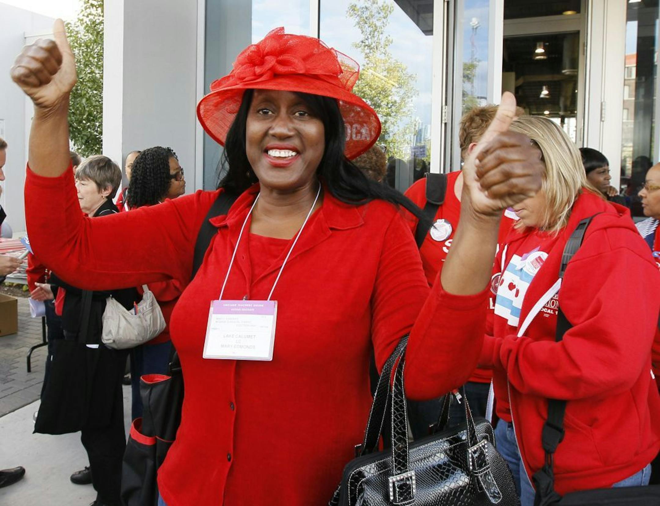 Mary Edmonds, a member of the Chicago Teachers Union's House of Delegates, celebrates after the delegates voted to suspend the strike against the school district Tuesday, Sept. 18, 2012, in Chicago. The city's teachers agreed to return to the classroom after more than a week on the picket lines, ending a spiteful stalemate with Mayor Rahm Emanuel that put teacher evaluations and job security at the center of a national debate about the future of public education.