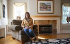 Susan Dusek, a real estate agent for Edina Realty, in the living room of a Tudor house for sale in the Congdon Park neighborhood of Duluth. More buyer