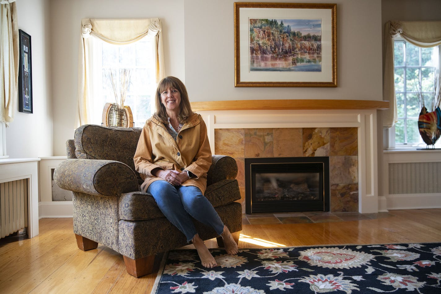 Susan Dusek, a real estate agent for Edina Realty, in the living room of a Tudor house for sale in the Congdon Park neighborhood of Duluth. More buyers than ever are relocating from the Twin Cities and other metro areas to Duluth as work-from-home options become permanent and the appeal of the outdoors lures younger buyers.