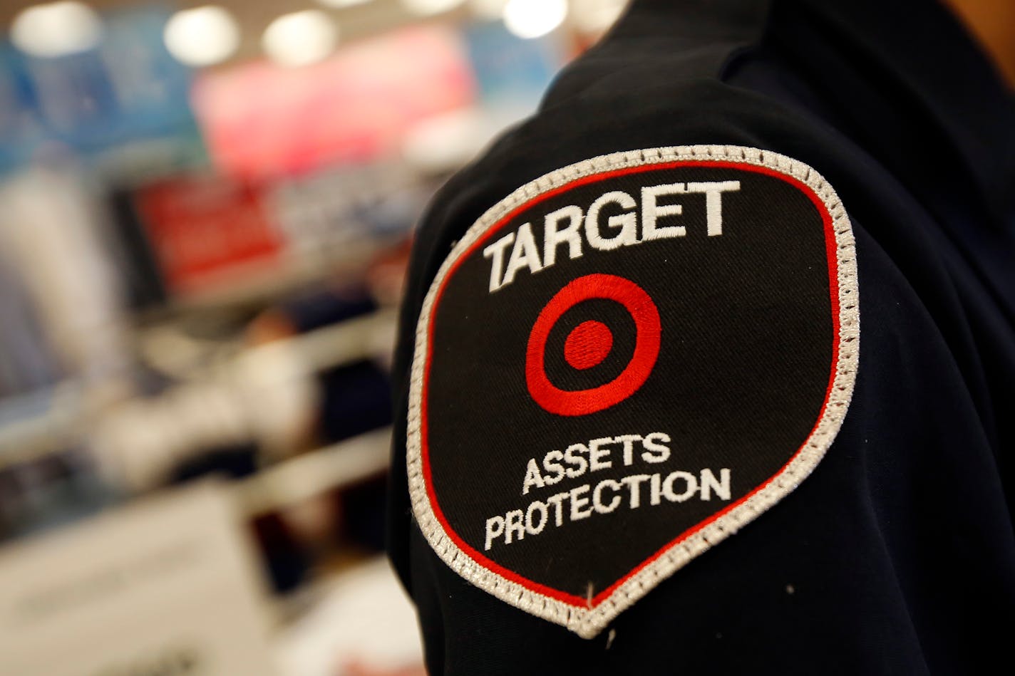 A Target Assets Protection team member stands inside a Target Corp. store in Torrance, California, U.S., on Tuesday, August 20, 2013. Target is expected to announce quarterly earnings results on Aug. 21, 2013. Photographer: Patrick T. Fallon/Bloomberg