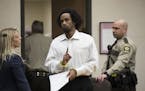 Mahad Abdiraham raised his index finger as he was photographed leaving the courtroom after his sentencing in the stabbing of two men at the Mall of Am