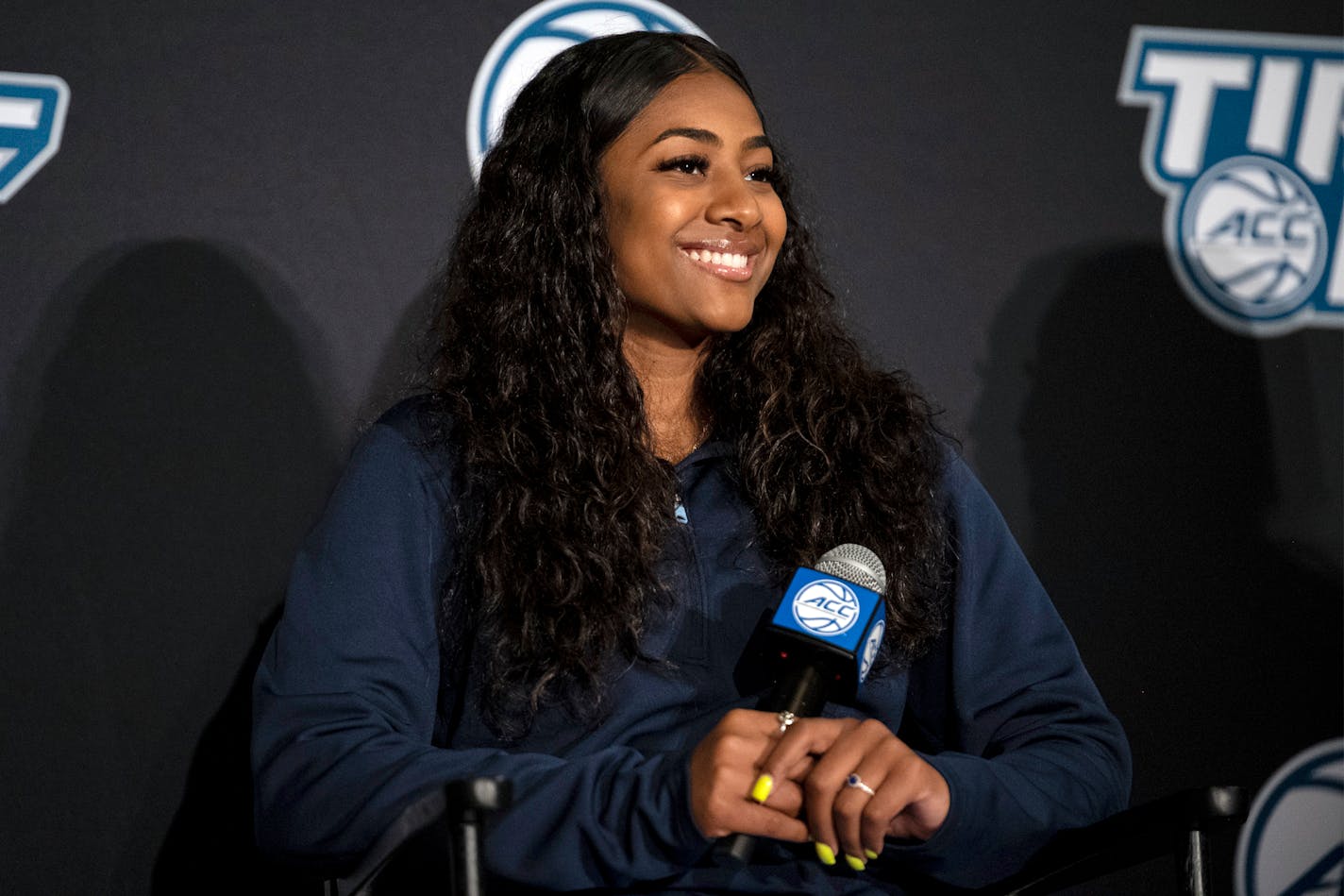 North Carolina guard Deja Kelly smiles during NCAA college basketball Atlantic Coast Conference media day, Wednesday, Oct. 13, 2021, in Charlotte, N.C. (AP Photo/Matt Kelley)