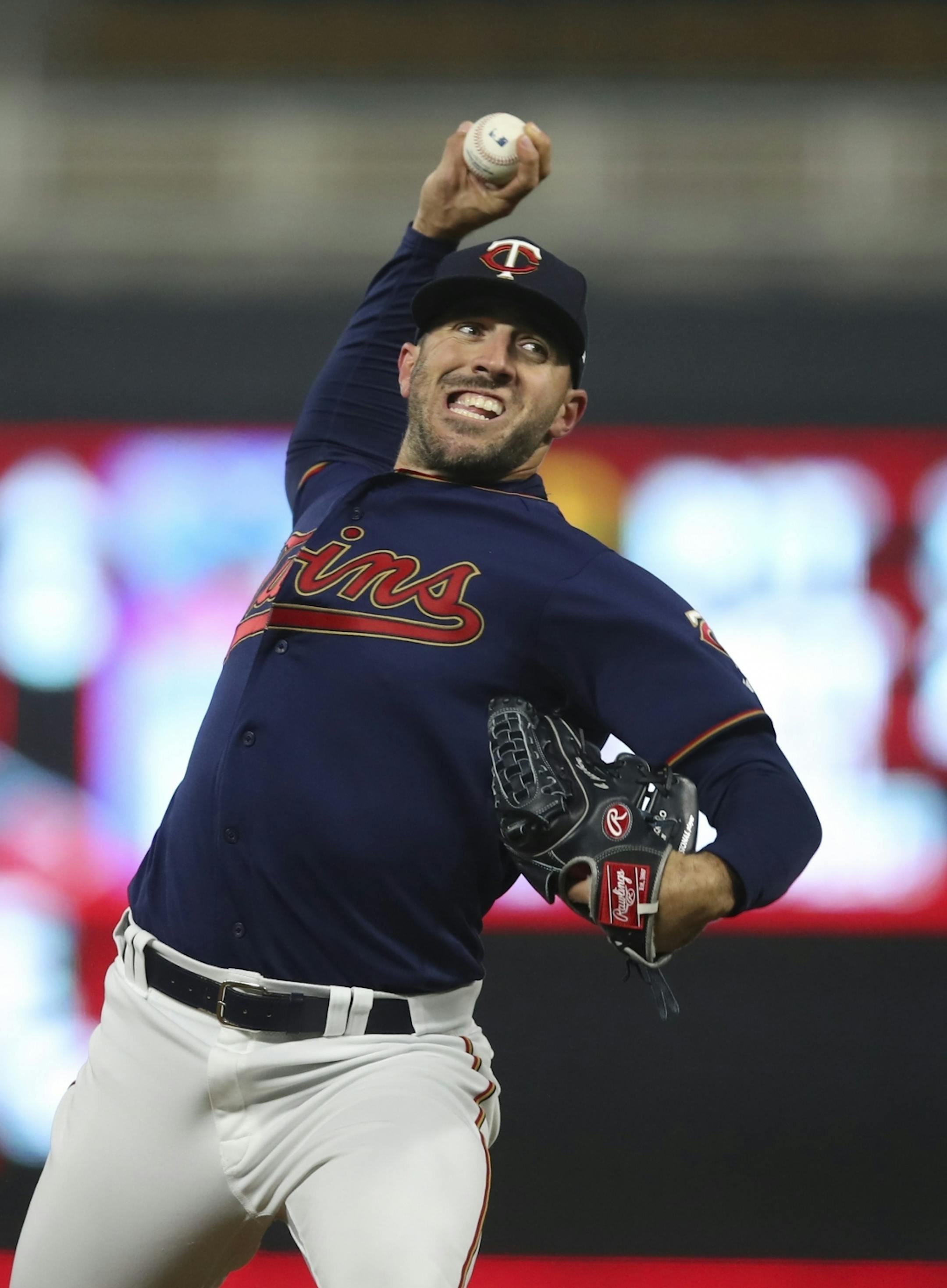 Minnesota Twins relief pitcher Blake Parker pitching in the ninth inning, when he struck out two batters.