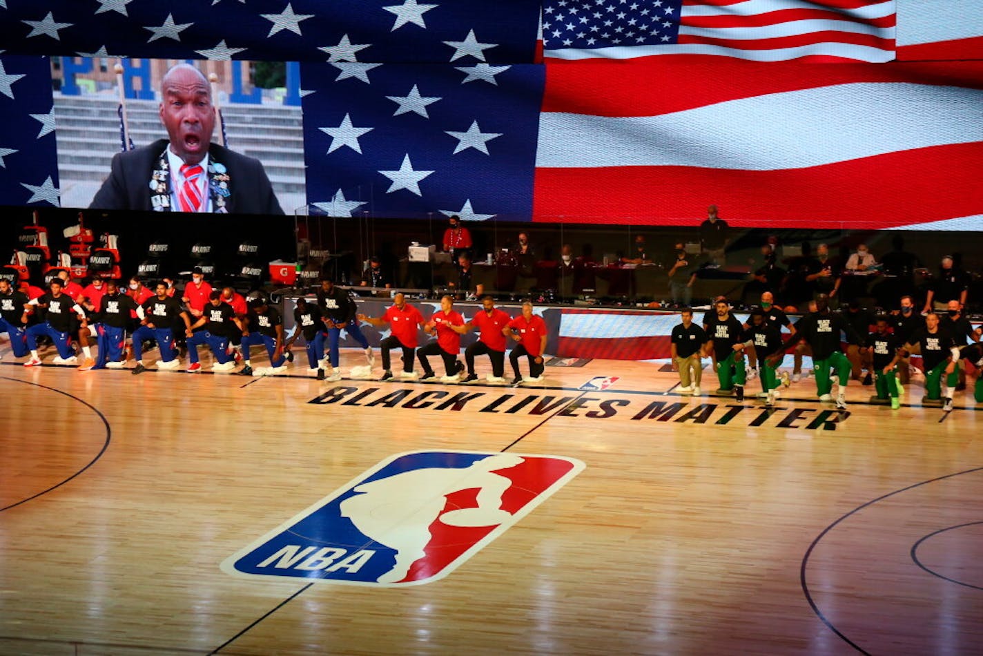 Philadelphia 76ers and Boston Celtics players kneel for the national anthem before Game 4 of their playoff series on Sunday.