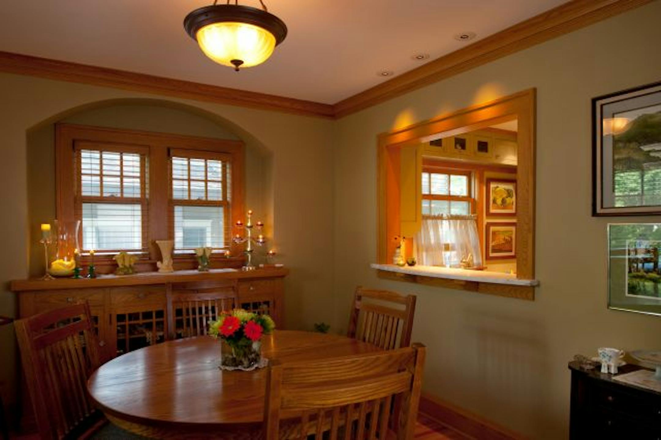 The oak dining room is an homage to the 1920s with its new-but-vintage-look passthrough window.