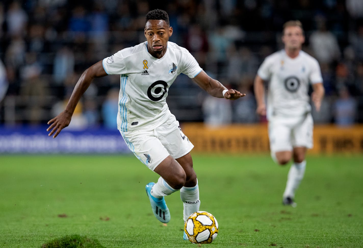 Minnesota United striker Mason Toye (shown in a 2019 match vs. Sporting Kansas City) said the Loons are preparing to beat the Orlando heat in the "MLS is Back" tournament. "We've been working hard to get acclimated to the weather, to the training times and the game times," he said