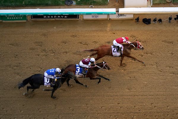 Rich Strike (21), with Sonny Leon aboard, beats Epicenter (3), with Joel Rosario aboard, and Zandon (10), with Flavien Prat aboard, at the finish line
