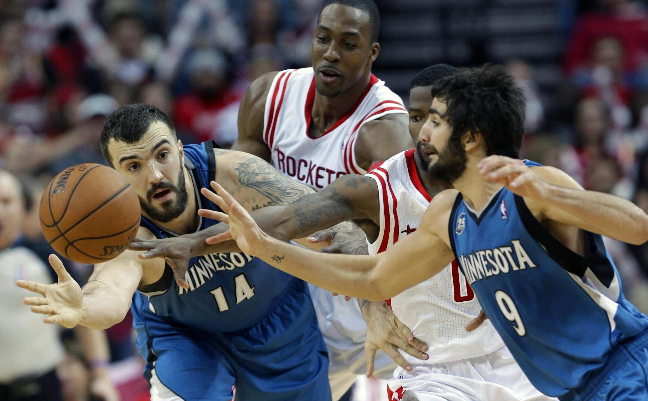 A show of hands: Wolves center Nikola Pekovic and guard Ricky Rubio teamed up to block out Houston&#x2019;s Dwight Howard, rear, and Aaron Brooks.