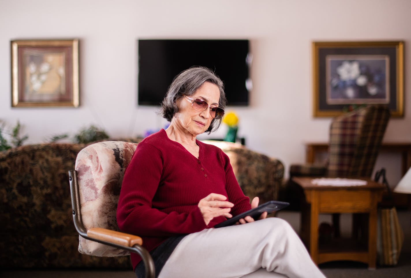 Carmen Mazzuchella poses for a portrait with her tablet at her senior living community. ] MARK VANCLEAVE &#xef; mark.vancleave@startribune.com * The city of Maple Grove is providing free tablets with low-cost internet data plans to some senior citizens. Photographed on Friday, April 6, 2018.