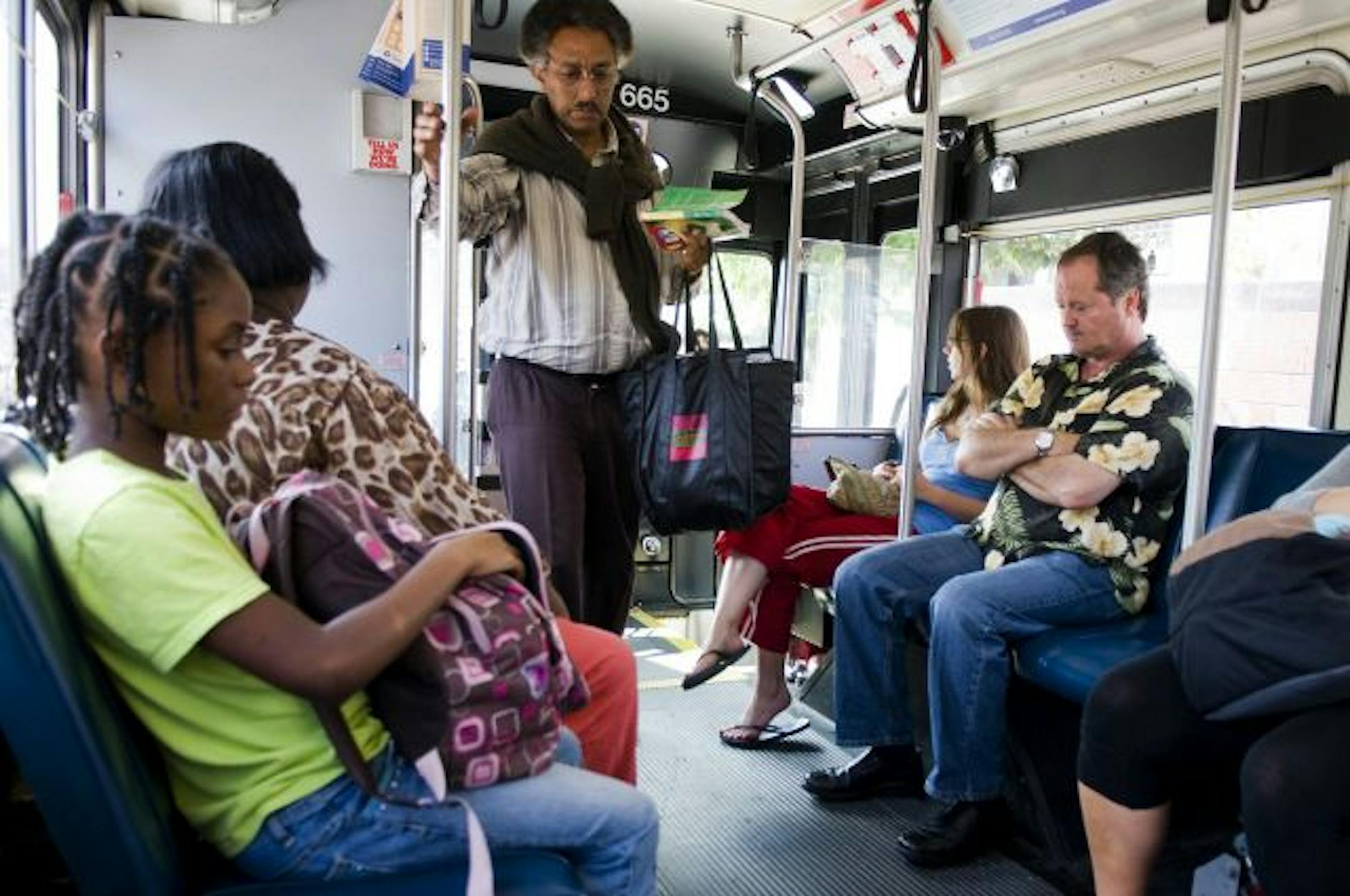 On Saturday afternoon, Metro Transit bus users wait to arrive at their destination while riding the No. 4 route city bus throughout downtown Minneapolis. The city buses are recently being compared to the suburban buses which are considered more of a luxury.