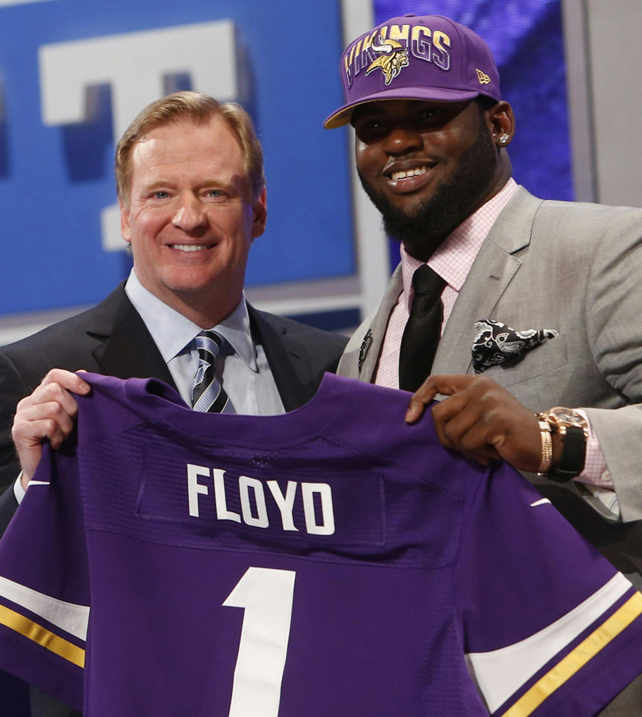 Sharrif Floyd, from Florida, stands with NFL Commissioner Roger Goodell after being selected 23rd overall by the Minnesota Vickings in the first round of the NFL football draft, Thursday, April 25, 2013, at Radio City Music Hall in New York. (AP Photo/Jason DeCrow) ORG XMIT: MIN2013042522125999