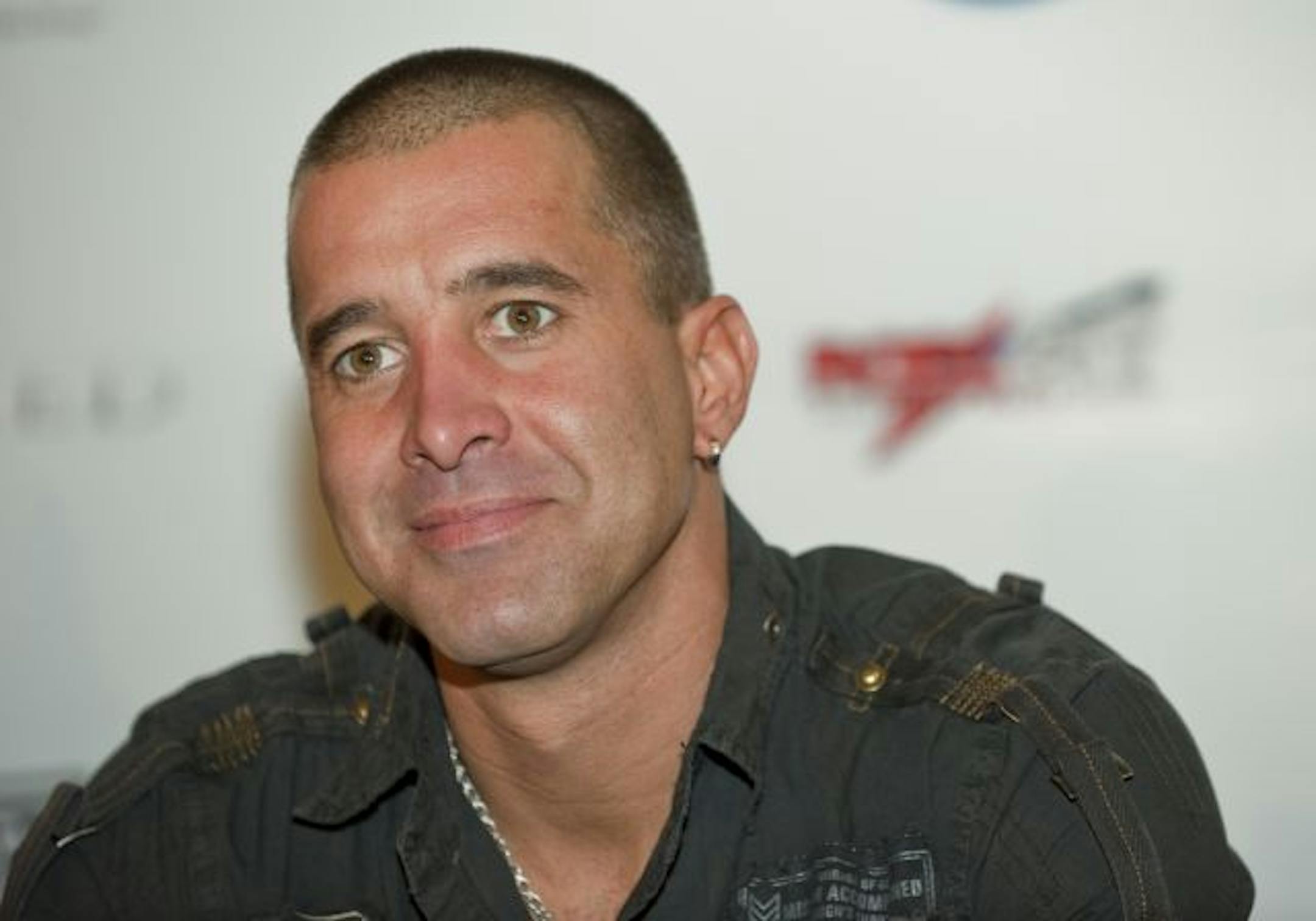 COMMERCIAL IMAGE: In this photograph taken by AP Images for ROCKPIT, Creed lead singer Scott Stapp listens to a question during a press conference before the band's show Friday, Sept. 25, 2009 in Houston. ROCKPIT.com has aligned with the USO to bring the concert to troops overseas by streaming the show shot with a record breaking 239 cameras.
